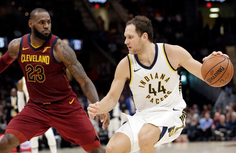 Indiana Pacers’ Bojan Bogdanovic, right, from Croatia, drives against Cleveland’s LeBron James on Wednesday, Nov. 1, 2017, in Cleveland.