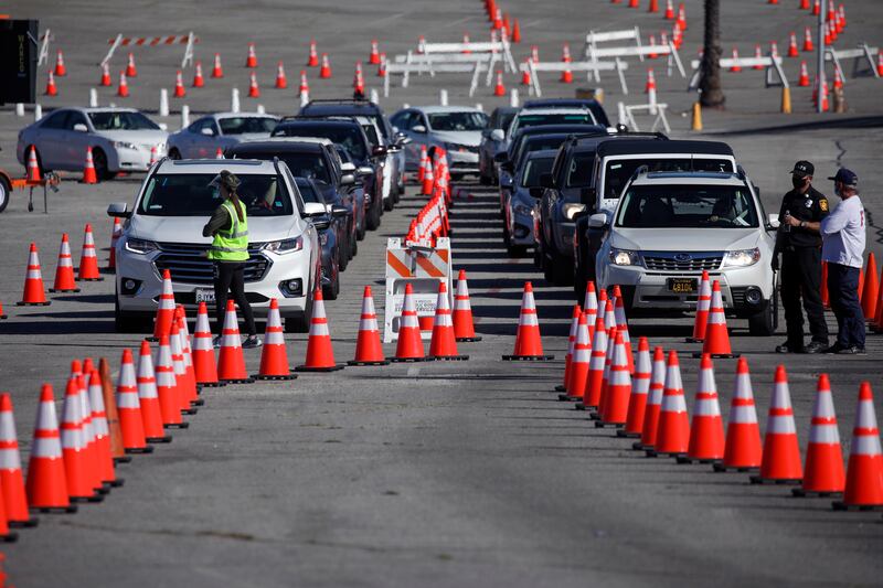 In this Friday, Jan. 15, 2021 file photo, COVID-19 mass-vaccination of healthcare workers takes place at Dodger Stadium, in Los Angeles.