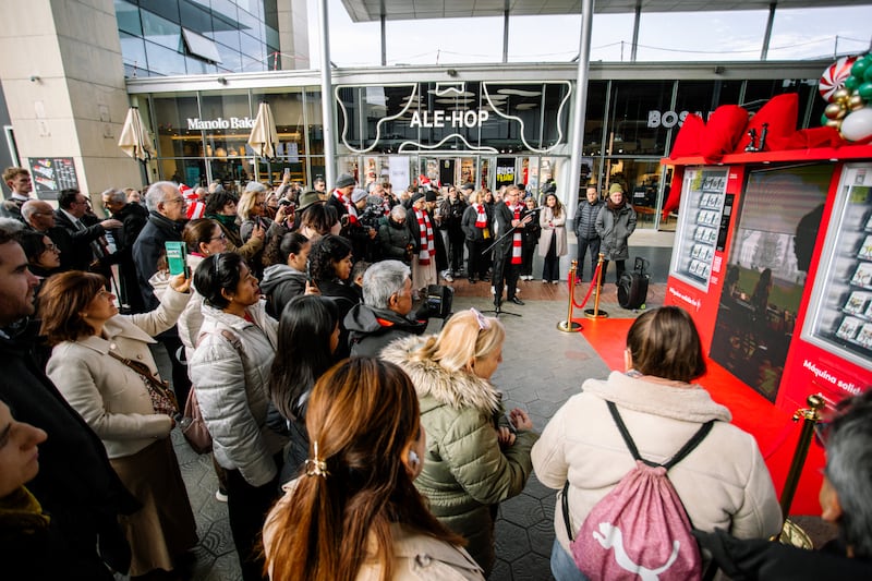 People gather to celebrate the arrival of Spain's first-ever Giving Machines at a shopping center in Barcelona, Spain, on Nov. 28, 2025.