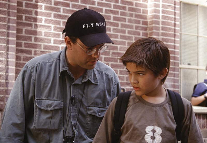 Rocco DeVilliers and Reiley McClendon talk on "The Flyboys"' set.
