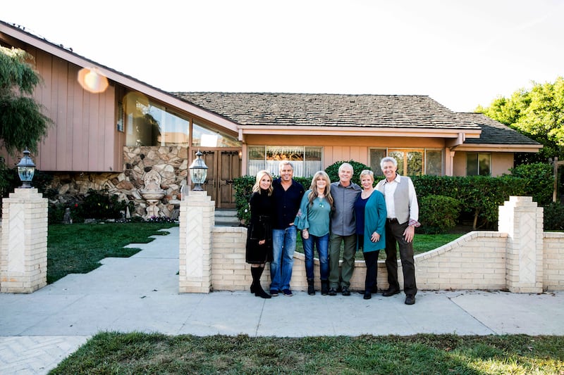 Members of “The Brady Bunch” cast, from left to right, Maureen McCormick, Christopher Knight, Susan Olsen, Mike Lookinland, Eve Plumb and Barry Williams pose in front of the original Brady home in the Studio City neighborhood in Los Angeles.
