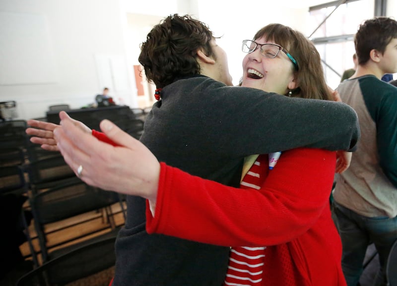 Amanda McPeck hugs Michael Cutler during Sunday Assembly in Salt Lake City on Sunday, Feb. 11, 2018. Sunday Assembly is a nonprofit group designed to serve atheists, agnostics, humanists and other religiously unaffiliated adults in Utah.