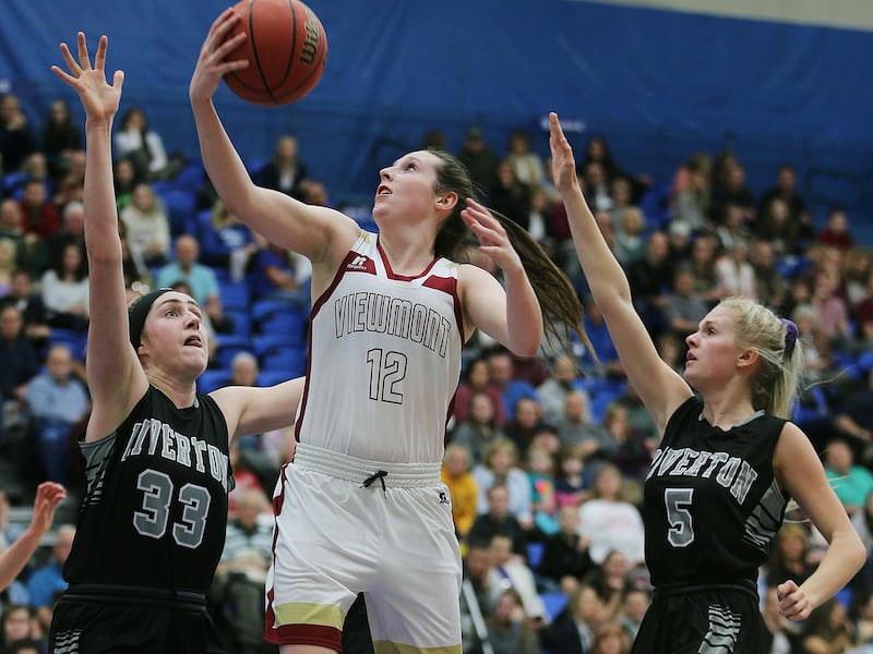 FILE: Mercedes Staples of Viewmont puts up a shot with Morgan Kane and Hannah Kalmar of Riverton defending during the girls 5A high school state basketball tournament in Salt Lake City on Monday, Feb. 20, 2017.