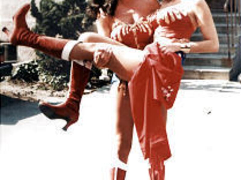 Stunt double Jeannie Epper hoists "Wonder Woman" Lynda Carter.