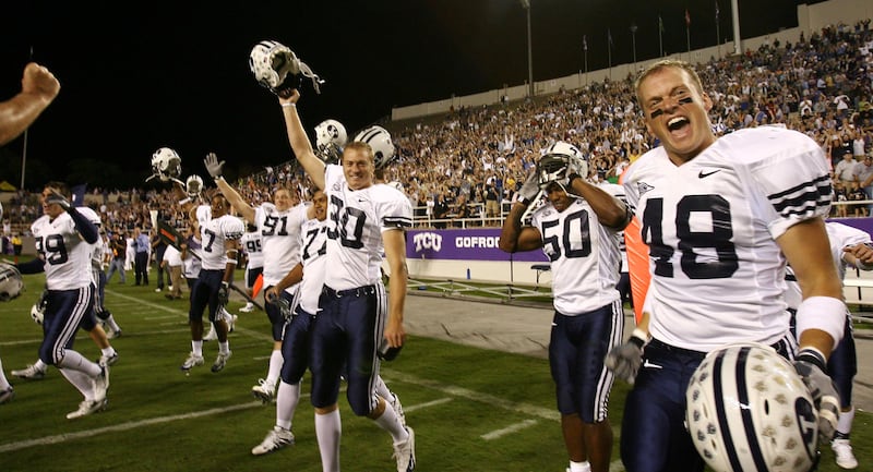 BYU players run onto the field after defeating TCU 31-17 in Fort Worth, Texas, on Sept. 28, 2006.