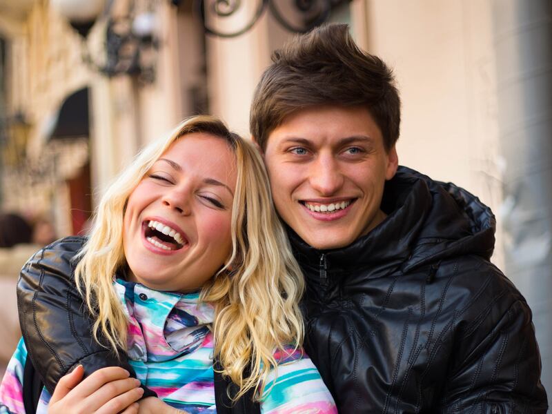Happy young couple smiling in love