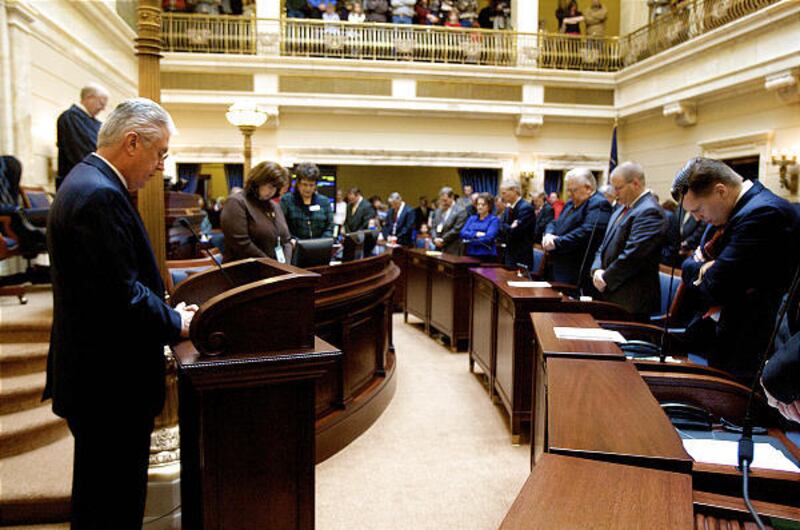 President Dieter F. Uchtdorf of the LDS Church's First Presidency prays Monday.