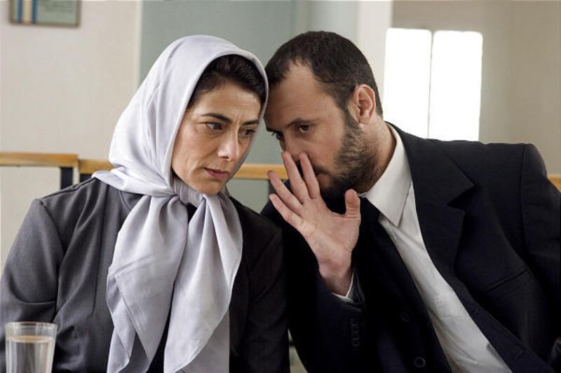 Hiam Abbass as Palestinian widow Salma Zidane and Ali Suliman as attorney Ziad Daud in "Lemon Tree."