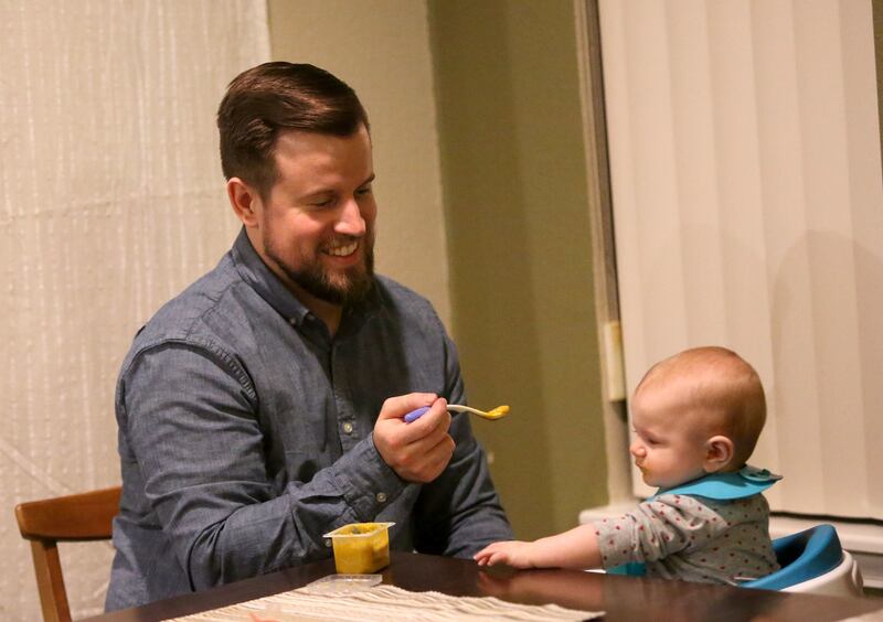 Jacob Gray feeds his daughter River Hixson-Gray at home in Sandy on Friday, Jan. 19, 2018.