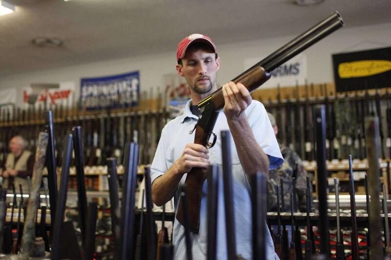 Adam Henderson shops for a rifle at Guns and Leather, a firearms store and shooting range, in Greenbrier, Tenn. in 2009. Gun sales are expected to rise on the heels of Barack Obama's re-election Tuesday.