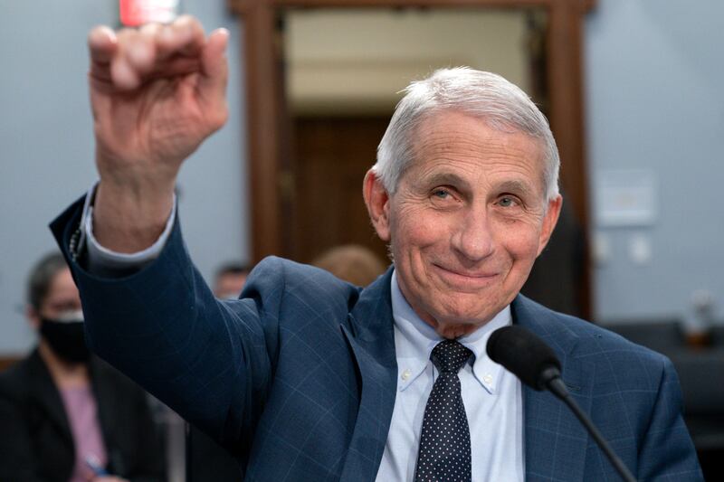 Dr. Anthony Fauci waves hello at the start of a House Committee on Appropriations subcommittee hearing on May 11, 2022.