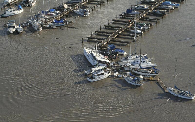 In this Friday, March 11, 2011 aerial photo released by the U.S. Coast Guard, Keehi Lagoon Small Boat Harbor is seen by a Coast Guard Air Station Barbers Point aircrew that scans the area noting damage to docks and boats after a tsunami, in Honolulu. Abou