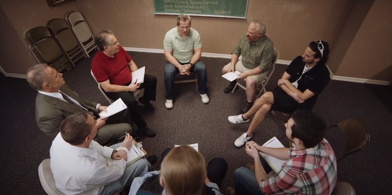 An addiction recovery group meeting is shown in a YouTube video of The Church of Jesus Christ of Latter-day Saint.