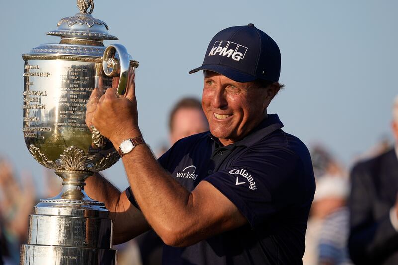 Phil Mickelson holds the Wanamaker Trophy after winning the PGA Championship on the Ocean Course in Kiawah Island, S.C.