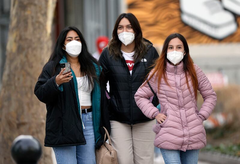 Dayana Bottger, Ana Polar and Kiessy Dominguez wear masks while walking through downtown Salt Lake City.