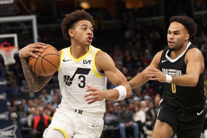 Utah Jazz guard Keyonte George (3) drives against Memphis Grizzlies guard Jacob Gilyard (0) during the first half of an NBA basketball in-season tournament game Friday, Nov. 10, 2023, in Memphis, Tenn. (AP Photo/Nikki Boertman)