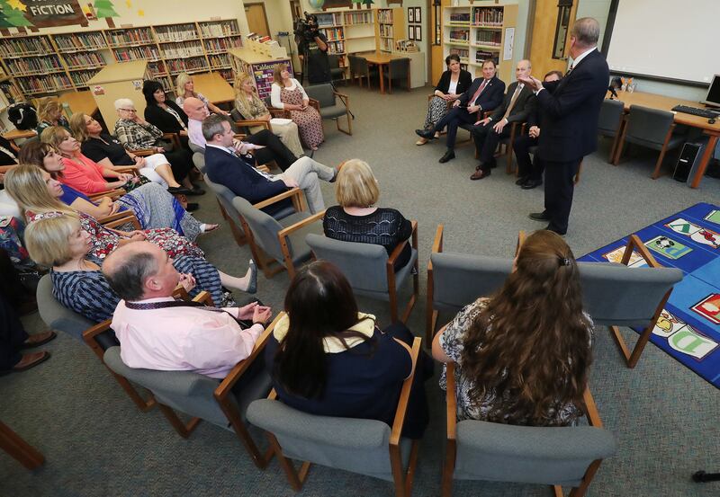 Tooele Superintendent Scott Rogers talks with Gov. Gary Herbert and school counselors and educators at Rose Springs Elementary School in Stansbury Park on Wednesday, Aug. 22, 2018. During his visit, Herbert also looked over school safety measures.