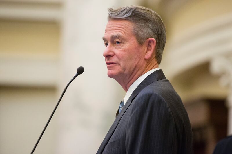Idaho Gov. Brad Little watches the proceedings before the State of the State address at the Capitol.