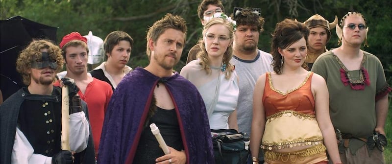 Voss (Devin McGinn) stands with other live action role-players in "Unicorn City."