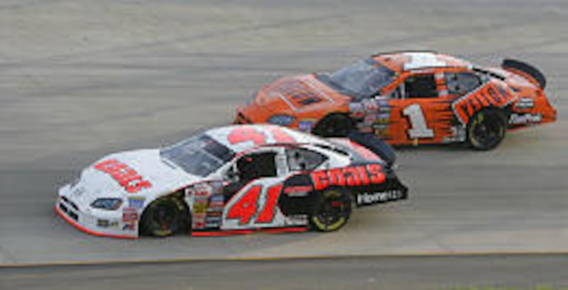 Rookie Reed Sorenson (41) passes Johnny Sauter (1) en route to the Pepsi 300 victory Saturday.