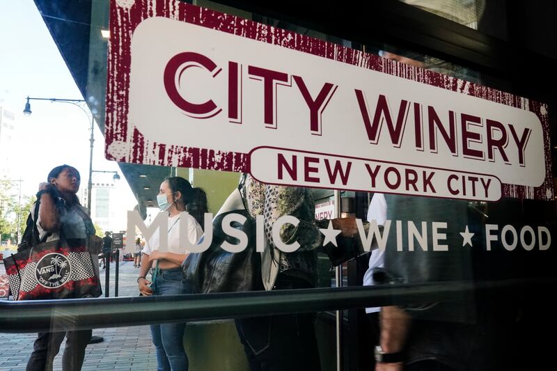 People are checked for proof of COVID vaccination in New York.