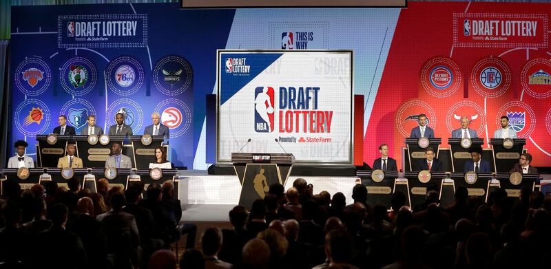 NBA team representatives participating in the NBA basketball draft lottery sit on stage Tuesday, May 15, 2018, in Chicago.