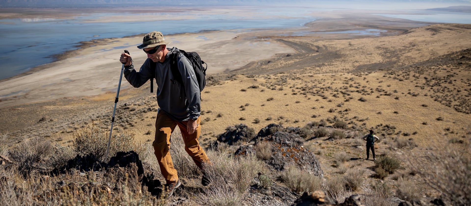 Jason Curry, deputy director of the Utah Division of Forestry, Fire and State Lands, and Marisa Weinberg, a minerals and surface lease analyst, hike on Fremont Island.