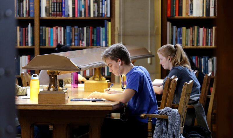 In this photo taken Tuesday, Oct. 15, 2013, University of Washington students study in Odegaard Library on the campus in Seattle.