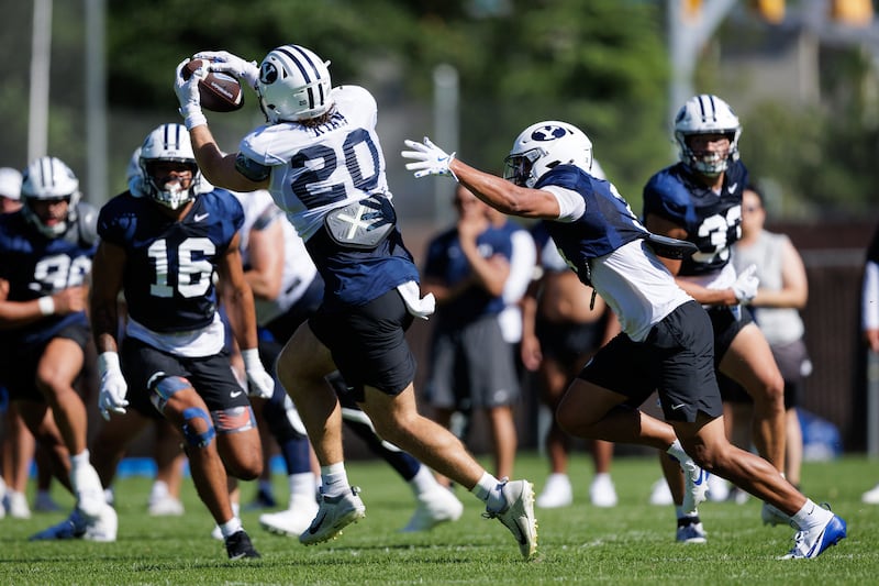 BYU tight end Carsen Ryan snares a catch during fall camp in Provo. Ryan began his college career at UCLA, then Utah before transferring to BYU in the offseason.