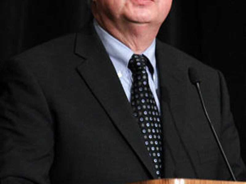 Larry EchoHawk of Indian Affairs speaks at a symposium focusing on children in Indian country.