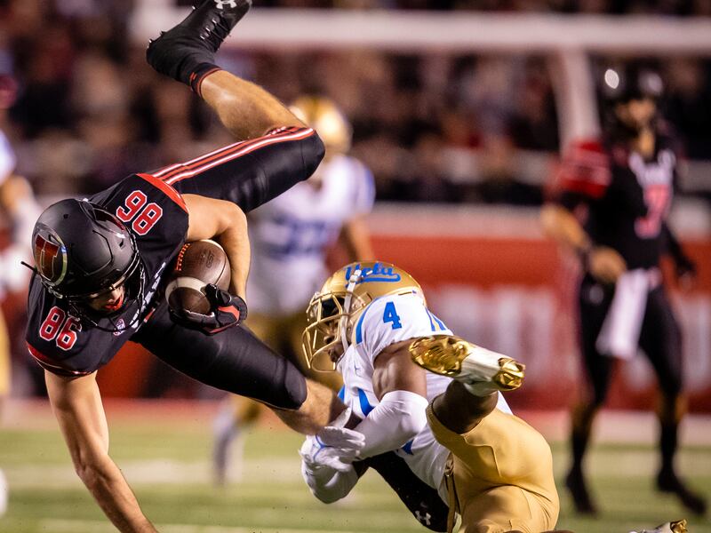 Utah Utes tight end Dalton Kincaid (86) is upended by UCLA Bruins defensive back Stephan Blaylock (4) in Salt Lake City.
