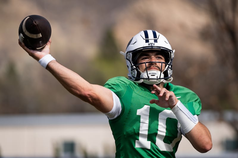 BYU quarterback Treyson Bourguet delivers a pass during practice March 23, 2026, at the outdoor practice facility in Provo, Utah.