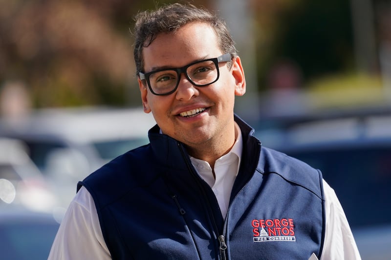 Republican candidate for New York’s 3rd Congressional District George Santos campaigns outside a store in Glen Cove, N.Y.