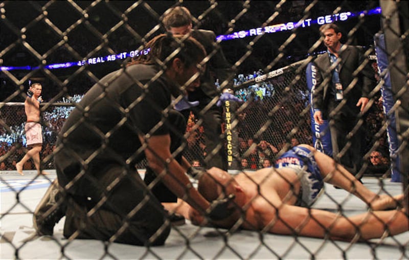 Rich Franklin, left, of Cincinnati, Ohio, celebrates after knocking out Chuck Liddell, right, of Santa Barbara, Calif., during UFC 115 in Vancouver, British Columbia, Canada, on Saturday June 12, 2010. (AP Photo/The Canadian Press,Darryl Dyck)