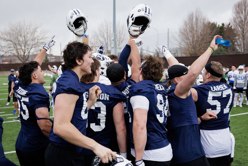 BYU defensive players break a huddle during spring practices in Provo.