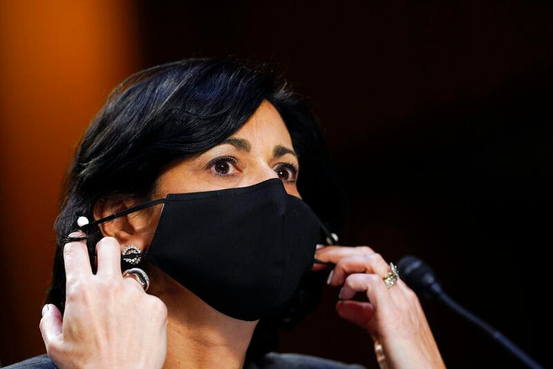Dr. Rochelle Walensky, director of the Centers for Disease Control and Prevention, adjusts her face mask.
