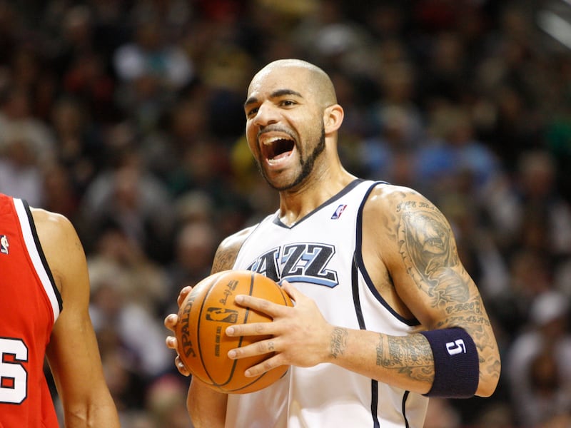 Utah Jazz’s Carlos Boozer (5) laughs after being fouled by the Portland Trail Blazers during a game Wednesday, Jan. 27, 2010, in Portland, Ore.