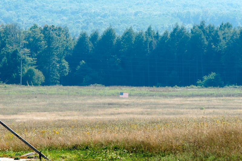 An American flag marks where Flight 93 crashed on 9/11.