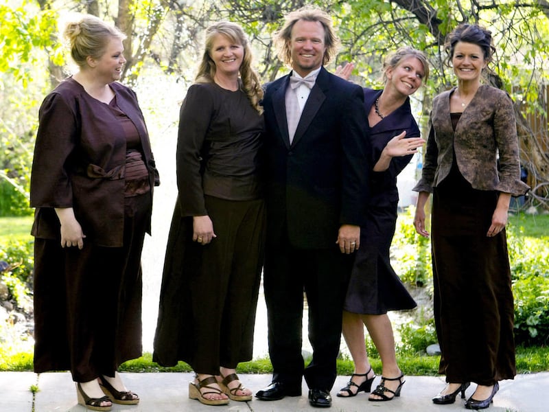 In this undated file photo provided by TLC, Kody Brown, center, poses with his wives, from left, Janelle, Christine, Meri, and Robyn in a promotional photo for TLC's reality TV show, "Sister Wives."