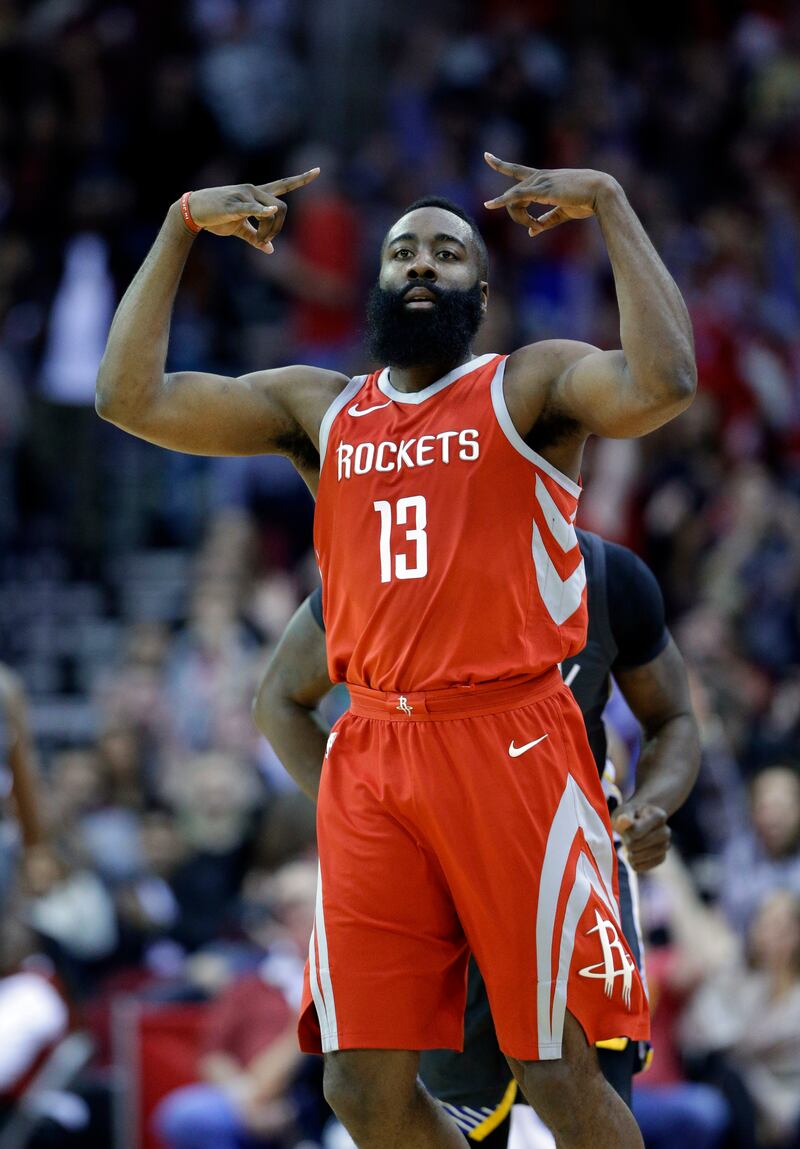Houston Rockets guard James Harden celebrates a 3-point shot during game against the Golden State Warriors Saturday, Jan. 20, 2018, in Houston.