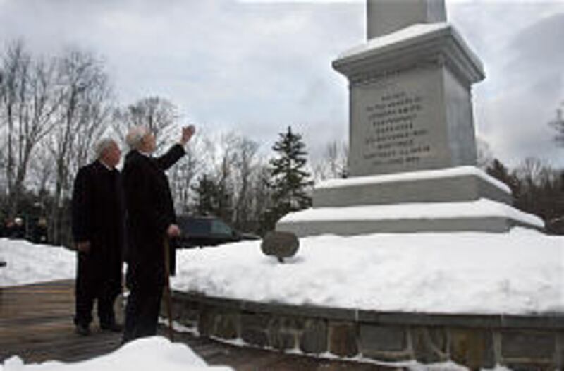 President Gordon B. Hinckley, right, and Elder M. Russell Ballard stand at the obelisk marking the birthplace of Joseph Smith in Sharon, Vt.