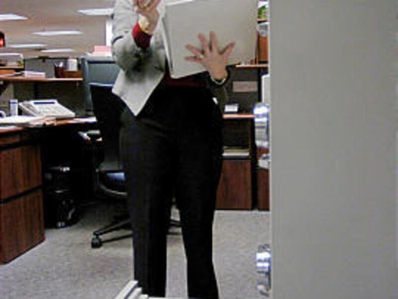 In 2005, Susan Chapman sorts through papers at Treasury Department offices in Parkersburg, W.Va.