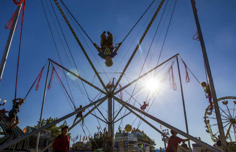 Children bounce on the Power Jump at the Utah State Fair at the Utah State Fair Park in Salt Lake City on Thursday, Sept. 10, 2015.