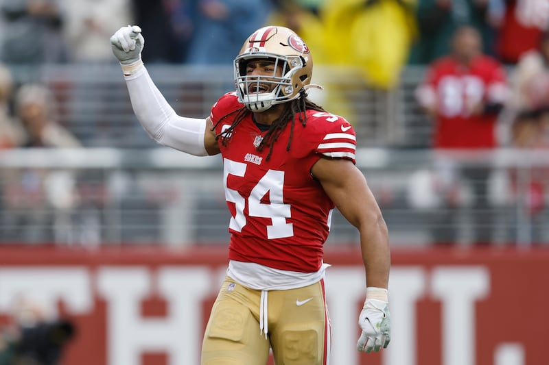 San Francisco 49ers linebacker Fred Warner motions during an NFL wild card playoff football game against the Seattle Seahawks