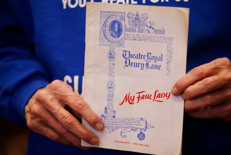 Doug Edmunds holds a program of "My Fair Lady" with Julie Andrews in Sandy on Nov. 7, 2017. Edmunds, 80, is a superfan of local theater and often goes to performances multiple times in each run -- sometimes twice a day so he can see the two different cas