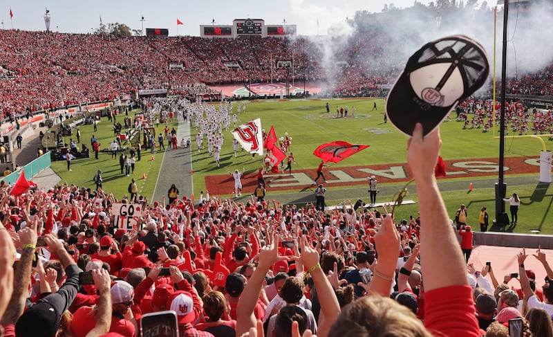Fans cheer as the Utes take the field vs. the Ohio State Buckeyes during the Rose Bowl in Pasadena, Calif., , Jan. 1, 2022.