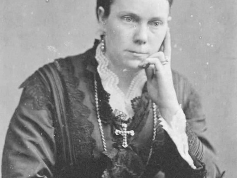 Amelia Young, wife of President Brigham Young, wears a cross in this photograph taken in 1895. Harriet Amelia Folsom Young was a plural wife of LDS Church president Brigham Young, married in 1863.