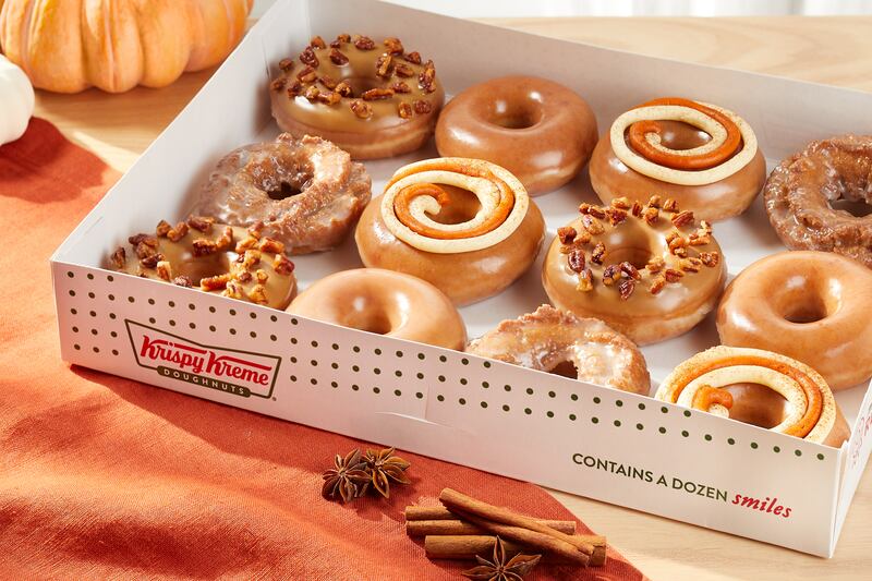 A box of 12 Krispy Kreme doughnuts is shown.