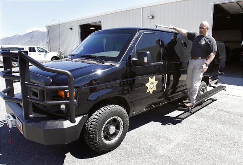 Sgt. Shaun Bufton, Utah County Metro SWAT commander, shows off the armored van.