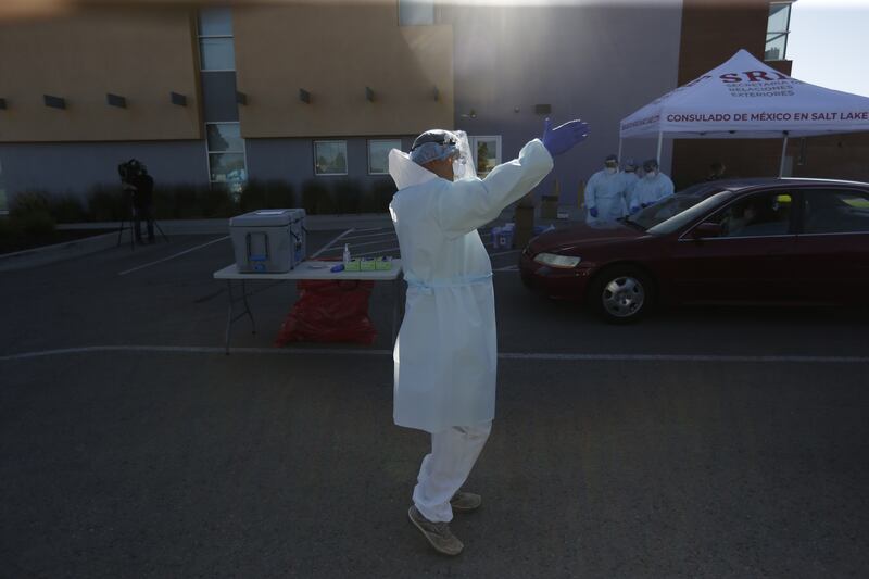 Sgt. Sebastian Rodriguez of the Utah Air National Guard, directs traffic at a COVID-19 test site at Esperanza Elementary School in West Valley City on Friday, Aug. 14, 2020. The Utah Department of Health, in collaboration with the Consulate of Mexico in Salt Lake City, the Utah Air National Guard and Esperanza Elementary School, invited the community to be tested for COVID-19, free of charge.